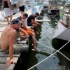 46_Erik,_Noah_and_Greg_fishing_off_the_dock_behind_Greg's_boat