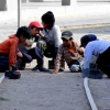 07-shoe-shine-boys-playing-marbles-on-the-tracks