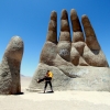 57-whos-holding-who-this-huge-hand-sculpture-sits-in-the-middle-of-chiles-northern-desert