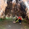 14-kacey-pretending-to-warm-her-hands-on-a-fire-in-a-replica-of-a-fuegian-teepee-its-incredible-that-people-could-survice-down-here-in-such-barebones-types-of-shelters