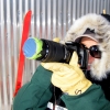 07-kacey-viewing-the-eclipse-through-the-camera-lense-with-a-piece-of-mylar-film-taped-over-the-end-like-a-filter