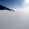 12-the-ice-sheet-is-an-endless-sea-of-white-you-can-barely-see-the-station-and-the-2-mile-long-runway-under-the-tip-of-the-wing