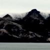 42-a-few-of-the-days-we-were-in-akaroa-the-weather-was-not-that-great-here-you-can-see-clouds-flowing-over-the-rim-of-the-volcano-a-good-sign-that-bad-weather-was-on-its-way