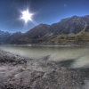 35-the-clear-waters-of-a-mountain-stream-spread-into-the-milky-glacial-lake-at-the-foot-of-mt-cook-without-mixing