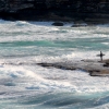 07-a-lone-surfer-waiting-for-the-perfect-break-and-spot-in-the-shade